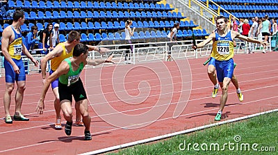 Athlets compete in relay race Editorial Stock Photo