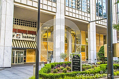 Boards on windows that were busted out by looters Editorial Stock Photo