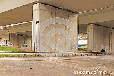 Homeless people camped out under a bridge Editorial Stock Photo