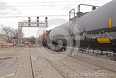 Black tanker train on a cloudy day close up Editorial Stock Photo