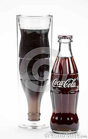 Atlanta, Georgia, USA April 1, 2020: closeup glass cup with shape in form of inverted contour bottle of Coca-Cola and Editorial Stock Photo