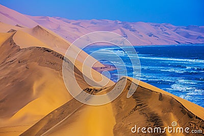 The Atlantic Ocean, moving sand dunes, Namibia Stock Photo