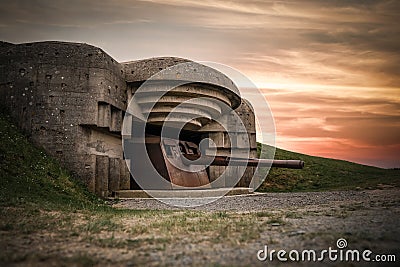 Atlantic wall concrete German World War Two gun emplacement fortification bunker battery Longues-sur-mer in Normandy Gold Beach Stock Photo