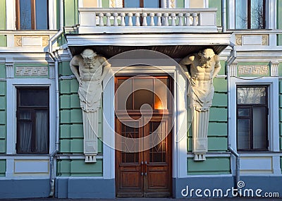 Atlants hold balcony in former Morozov Manor in Podsosensky Lane, Moscow, Russia Stock Photo