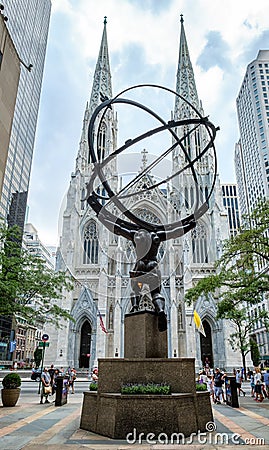 The Atlas Statue and Saint Patrick`s Cathedral in New York Editorial Stock Photo