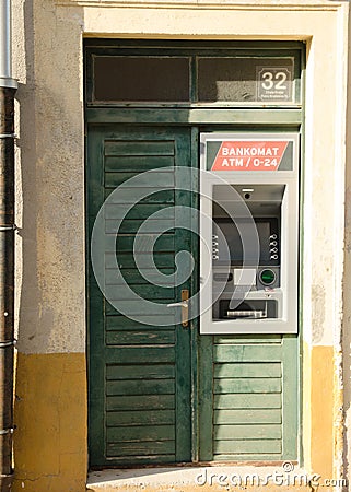 Atm bancomat in old green grunge door. Stock Photo