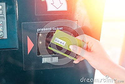 ATM and banking operations. A woman leans a Bank card in the reader at the ATM. Close up Stock Photo