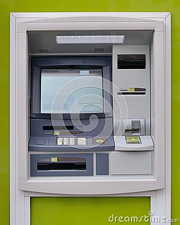 ATM on a green background Stock Photo