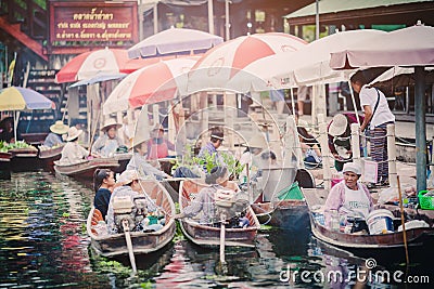 The atmosphere of trading goods and food, on vintage boats at Tha Kha Floating Market Editorial Stock Photo