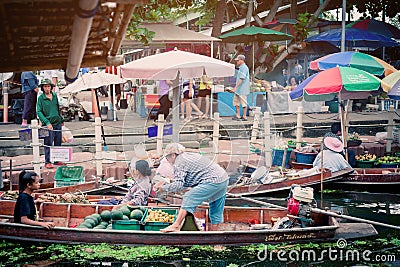 The atmosphere of trading goods and food, on vintage boats at Tha Kha Floating Market Editorial Stock Photo