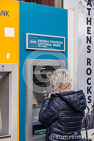 ATMs or many Greek national banks in the center of Athens, the Greek capita Editorial Stock Photo