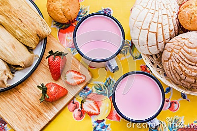 Atole de fresa, mexican traditional beverage and bread, Made with cinnamon and strawberries in Mexico Stock Photo