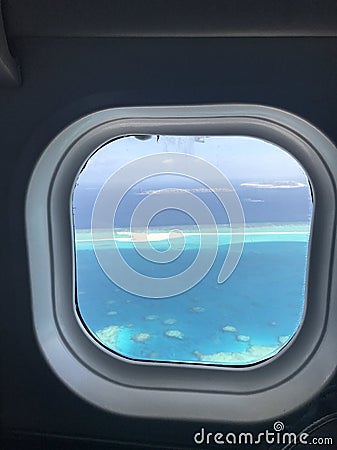 Atolls of the Maldives outside of a plane window Stock Photo