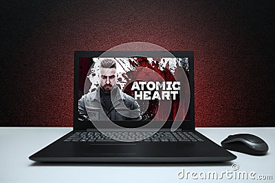 Atomic Heart computer game logo on laptop screen. Editorial Stock Photo