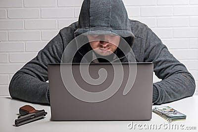The attacker steals personal data in the computer, the hacker Stock Photo