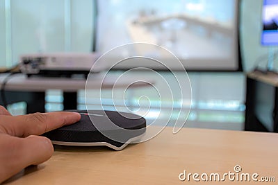 The attendees are using their fingers to press the microphone to speak in response Stock Photo