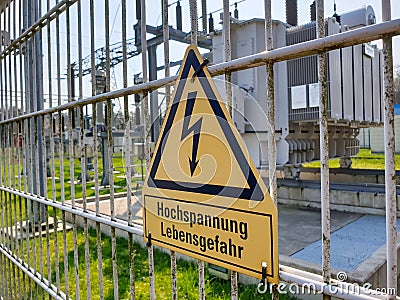 Attention! High voltage! risk of death! in german Stock Photo