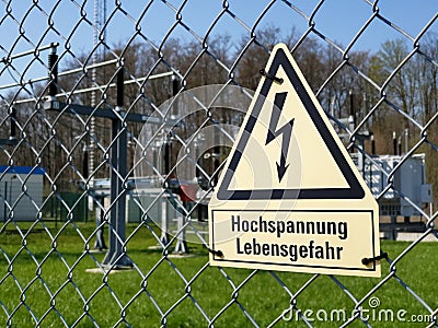 Attention! High voltage! risk of death! in german Stock Photo