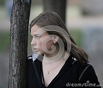 Attentive angry young woman Stock Photo