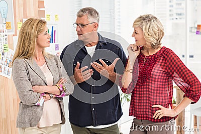 Attentive business team discussing together Stock Photo