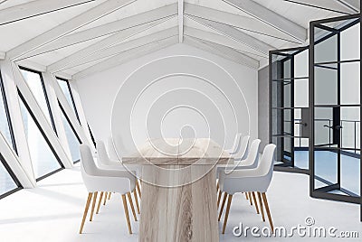 Attic meeting room, white ceiling, wooden table Stock Photo