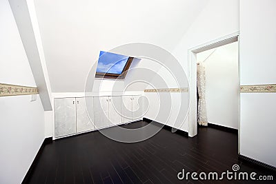 Attic room with roof skylight window Stock Photo