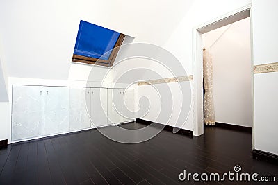 Attic room with roof skylight window Stock Photo