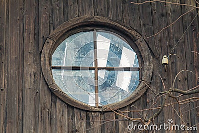 Attic window in a deserted house Stock Photo