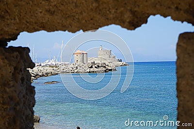 Windmill pier at the commercial harbor in Rhodes city. Rhodes, Greece Stock Photo