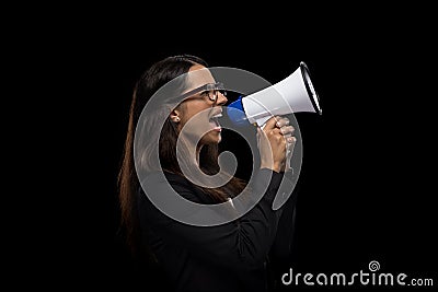 Attractive angry businesswoman yelling in megaphone Stock Photo