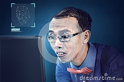 Attractive asian businessman using face recognition Stock Photo