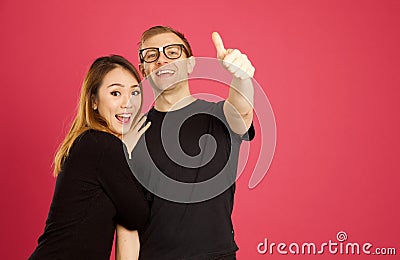 Attractive asian and caucasian inter racial couple giving the th Stock Photo