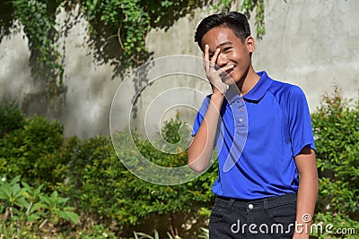 A Bashful Youthful Filipino Male Stock Photo