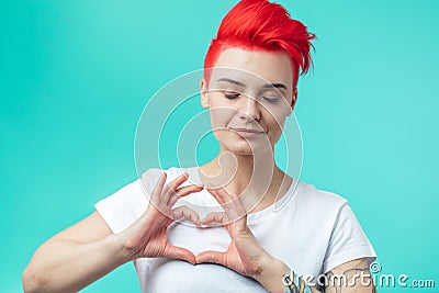 Attractive awesome girl making a heart gesure Stock Photo