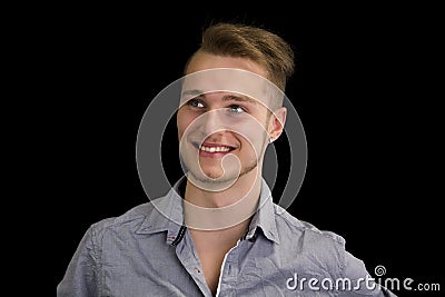 Attractive blond, blue eyed young man smiling Stock Photo