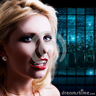 Attractive blond haired vampire in a night scene Stock Photo