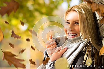 Attractive blond woman in the autumn sun Stock Photo