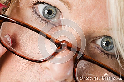 attractive blond woman reading glasses Stock Photo