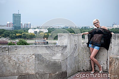 Attractive blonde on the fortress wall Stock Photo