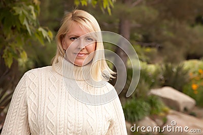 Attractive Blonde Woman in the Park Stock Photo