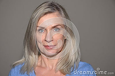 Attractive blue-eyed blond middle-aged woman Stock Photo