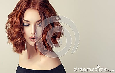 Attractive brown haired woman with modern, trendy and elegant hairstyle. Stock Photo