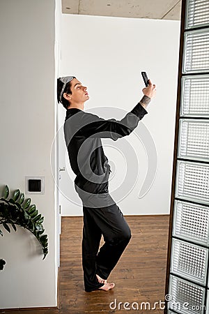 attractive brunette guy looking for wi-fi, internet conncection Stock Photo