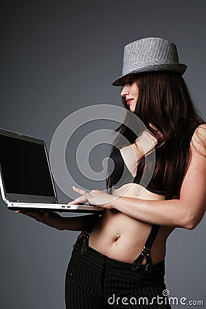 Attractive brunette with a laptop. Stock Photo