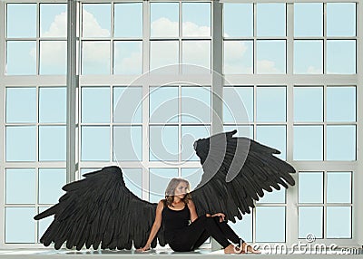 Attractive brunette model woman dark angel portrait Stock Photo