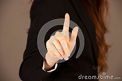 Attractive business woman pressing a virtual button Stock Photo