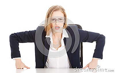 Attractive business woman by the table, bossy behaviour. Stock Photo