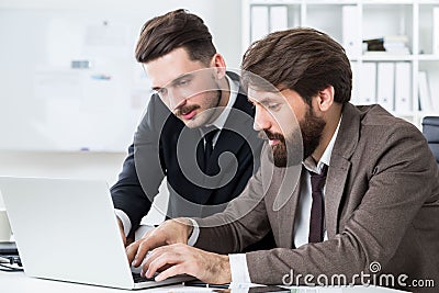 Attractive businesspeople discussing project Stock Photo