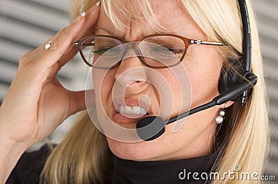 Attractive Businesswoman with Phone Headset Stock Photo