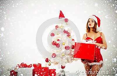 Attractive Christmas girl in a sexual lingerie. Naked body. Seasonal christmas holidays sale discounts. Woman in a sexy Stock Photo